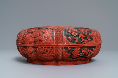 A Chinese cinnabar lacquer box and cover with figures in a landscape, 19th C.