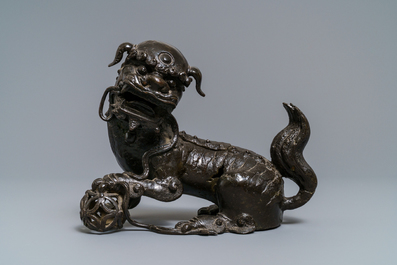 A Chinese bronze model of a Buddhist lion, Ming
