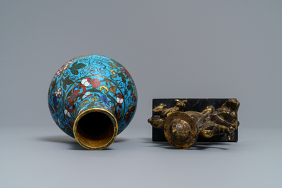 A Chinese cloisonn&eacute; bottle vase and a gilt bronze group, 18/19th C.