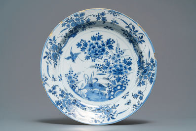 A Dutch Delft blue and white chinoiserie vase and a dish, late 17th C.