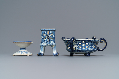 A Dutch Delft blue and white salt, a reticulated stand and a chafing dish, 18th C.