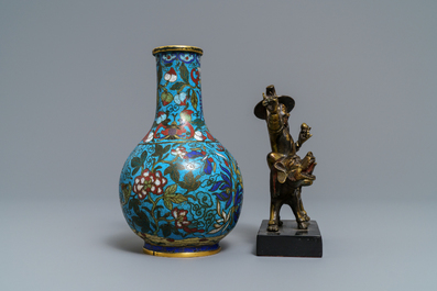 A Chinese cloisonn&eacute; bottle vase and a gilt bronze group, 18/19th C.