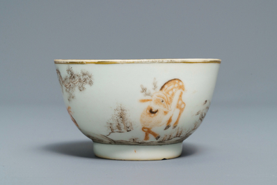 A Chinese grisaille and iron red cup and saucer with deer, Yongzheng/Qianlong