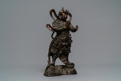 A Chinese gilt-lacquered bronze figure of Weituo, Ming