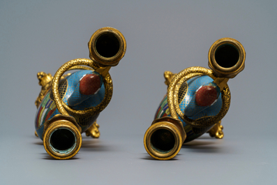 A pair of Chinese cloisonn&eacute; gilt bronze candelabra mounted cranes, 18/19th C.