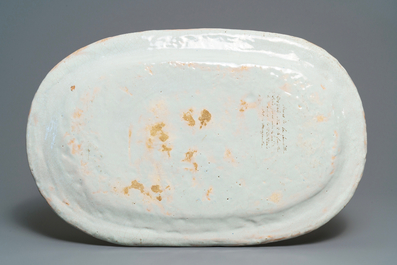 A large blue and white oval French faience dish with the arms of Barres, Rouen, 18th C.