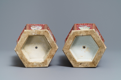 A pair of Chinese reticulated double-walled hexagonal famille rose vases, Yongzheng