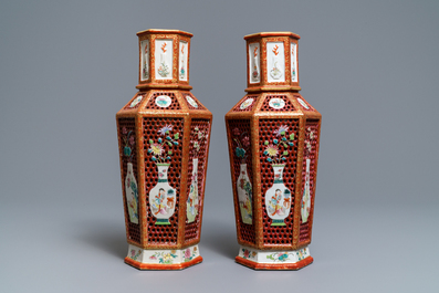 A pair of Chinese reticulated double-walled hexagonal famille rose vases, Yongzheng