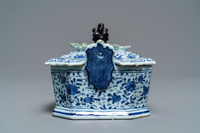 A Dutch Delft blue and white grape-topped butter tub, 18th C.