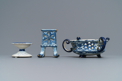 A Dutch Delft blue and white salt, a reticulated stand and a chafing dish, 18th C.