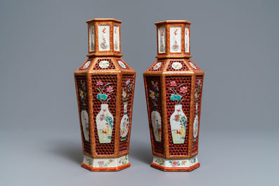 A pair of Chinese reticulated double-walled hexagonal famille rose vases, Yongzheng