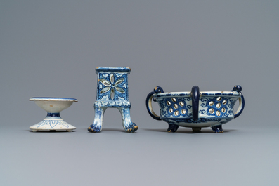 A Dutch Delft blue and white salt, a reticulated stand and a chafing dish, 18th C.