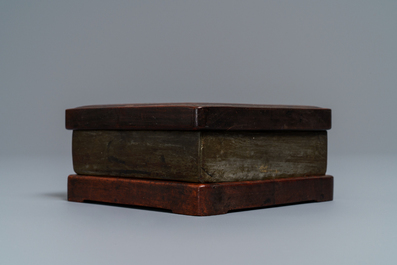 A square Chinese inscribed wood-encased duan inkstone, 19/20th C.