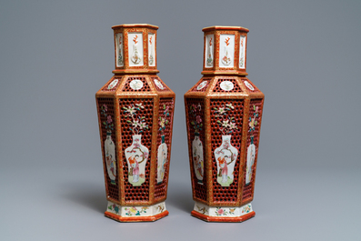 A pair of Chinese reticulated double-walled hexagonal famille rose vases, Yongzheng