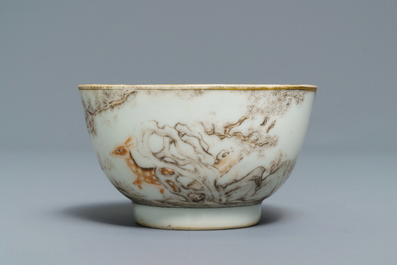 A Chinese grisaille and iron red cup and saucer with deer, Yongzheng/Qianlong