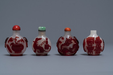 Four Chinese red overlay snowflake glass snuff bottles, 18/20th C.