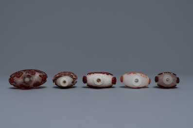 Ten Chinese red overlay, snowflake and transparent glass snuff bottles, 18/20th C.