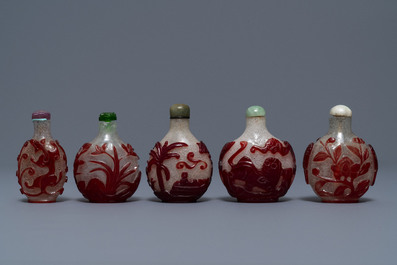 Five Chinese red overlay snowflake glass snuff bottles, 18/20th C.