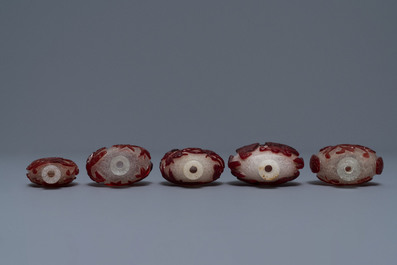 Five Chinese red overlay snowflake glass snuff bottles, 18/20th C.