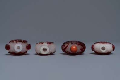 Four Chinese red overlay snowflake glass snuff bottles, 18/20th C.