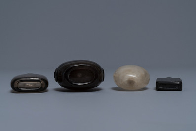 Four Chinese smokey quartz and simulating glass snuff bottles, 18/19th C.