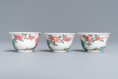 A Chinese famille rose teapot, six saucers and three cups, Yongzheng/Qianlong