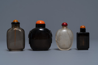 Four Chinese smokey quartz and simulating glass snuff bottles, 18/19th C.