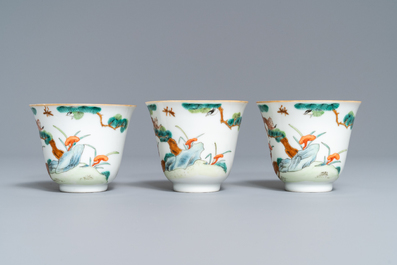 Three Chinese famille verte 'deer and monkey' cups and saucers, Tongzhi mark and of the period