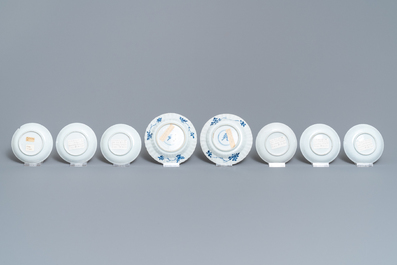 Eight Chinese blue and white and famille rose cups and saucers and three plates, Kangxi/Qianlong