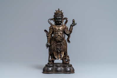 A Chinese gilt-lacquered bronze figure of Weituo, Ming