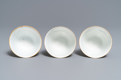 Three Chinese famille verte 'deer and monkey' cups and saucers, Tongzhi mark and of the period
