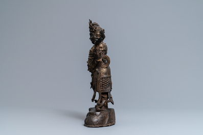 A Chinese gilt-lacquered bronze figure of Weituo, Ming