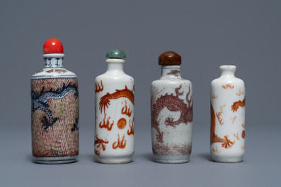 Four Chinese iron- and copper-red porcelain 'dragon' snuff bottles, 19/20th C.