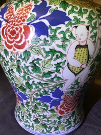 A Chinese wucai 'boys and peony scrolls' vase, 19th C.