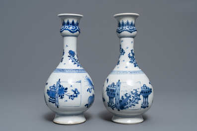 A pair of Chinese blue and white vases with antiquities and flowers, Kangxi