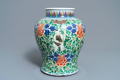 A Chinese wucai 'boys and peony scrolls' vase, 19th C.