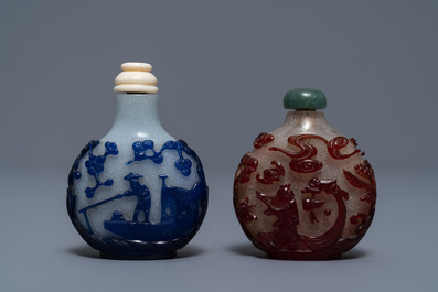 Two Chinese overlay red and blue snowflake glass snuff bottles, 19th C.