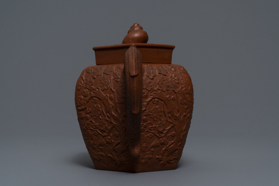 A large Chinese Yixing stoneware teapot with applied design, Kangxi