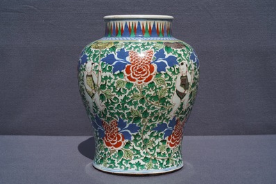 A Chinese wucai 'boys and peony scrolls' vase, 19th C.
