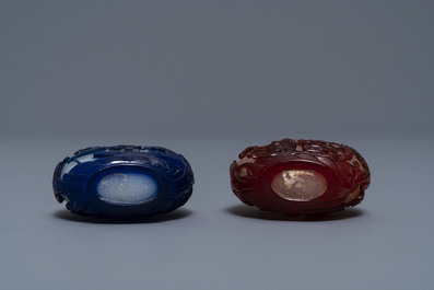 Two Chinese overlay red and blue snowflake glass snuff bottles, 19th C.