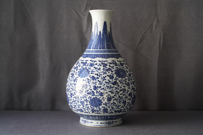 A Chinese blue and white 'peony scroll' bottle vase, Qianlong