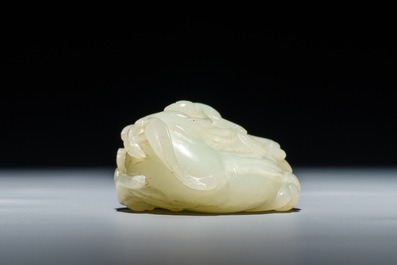 A Chinese celadon jade carving of two monkeys on a peach, 19th C.