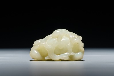 A Chinese celadon jade carving of two monkeys on a peach, 19th C.