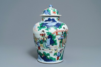 A Chinese wucai vase and cover with figures in a garden, seal mark, Transitional period