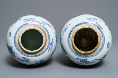 A pair of Chinese blue and white jars with boys in a garden, Kangxi