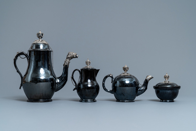A four-piece silver-mounted Namur black-glazed pottery coffee service, 18th C.