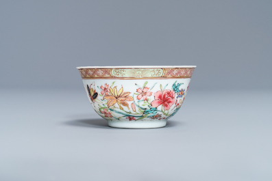 A fine Chinese famille rose cup and saucer with flowers and insects, Yongzheng