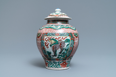 A Chinese wucai &lsquo;mythical beasts&rsquo; vase and cover, Transitional period