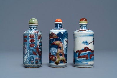 Three Chinese blue, white and underglaze red snuff bottles, Yongzheng marks, 19th C.