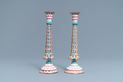 A pair of Chinese Canton enamel candlesticks with floral design, Yongzheng
